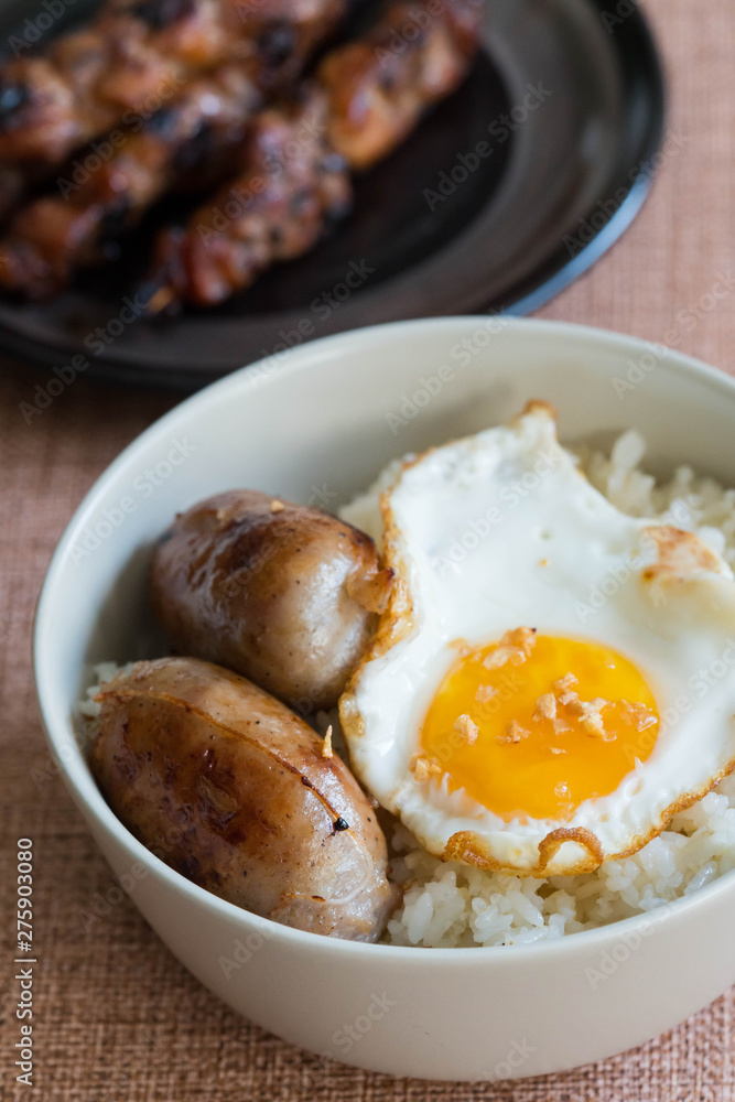 longgasilog, Filipino style hotdog with egg on top of garlic rice is one of favorite dishes of Filipinos longgasilog, Filipino style hotdog with egg on top of garlic rice is one of favorite dishes of Filipinos