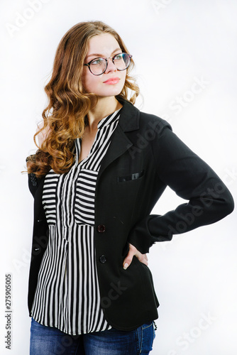 Portrait on successful businrss woman in glasses and dressed in jacket isolated on white photo