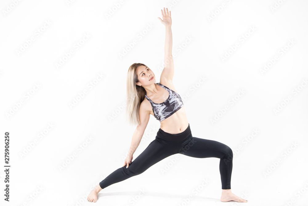 Sporty Asian young woman doing yoga practice isolated on white background.