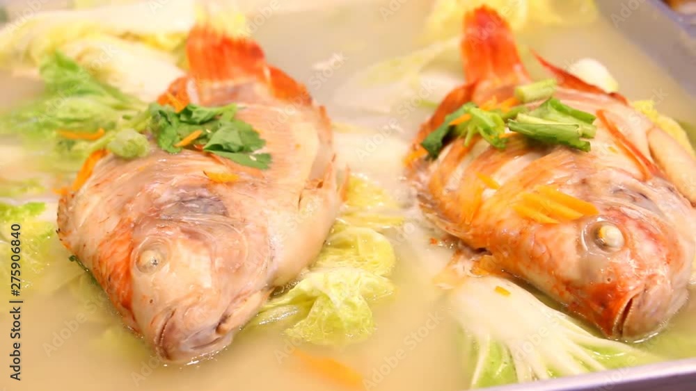 Steaming red tilapia fish, Chiangmai Thailand Steaming red tilapia fish, Chiangmai Thailand