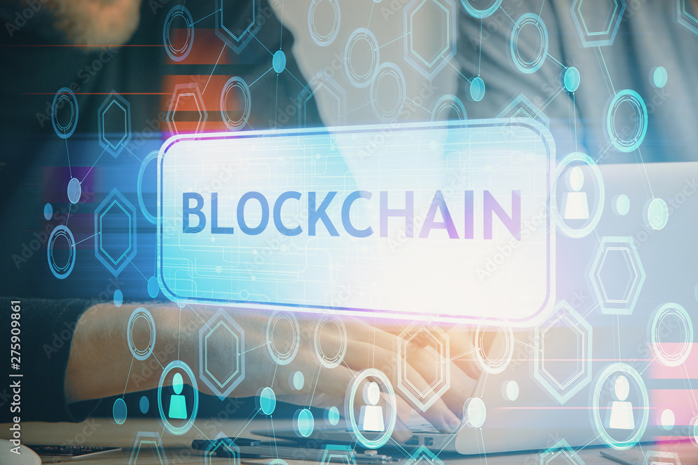 Crypto currency theme hologram with businessman working on computer on background. Concept of blockchain. Double exposure. Crypto currency theme hologram with businessman working on computer on background. Concept of blockchain. Double exposure.