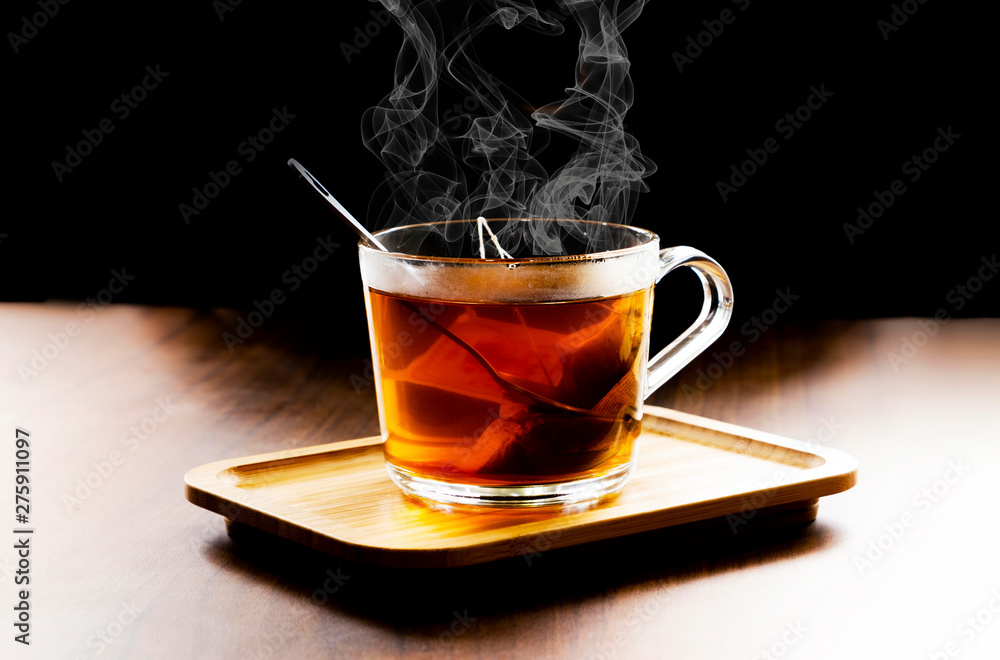 Hot herbal tea in dark background Hot herbal tea in dark background