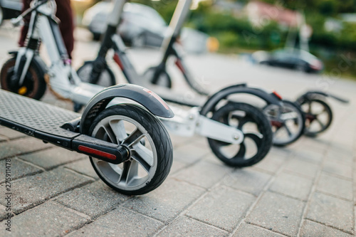 Electric scooter rental in the city. The problem of traffic jams, environmental transport in the city. photo