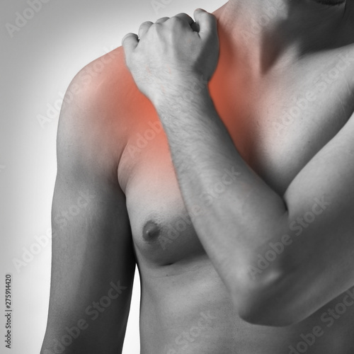 Man suffering from acute pain in shoulder