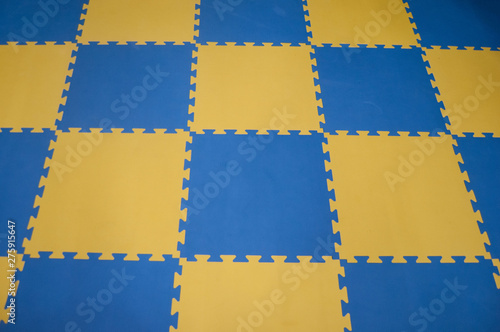 blue and yellow children puzzle carpet