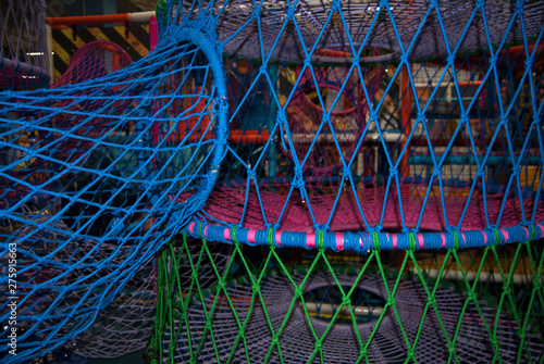 multicolored macro thread webs on a playground