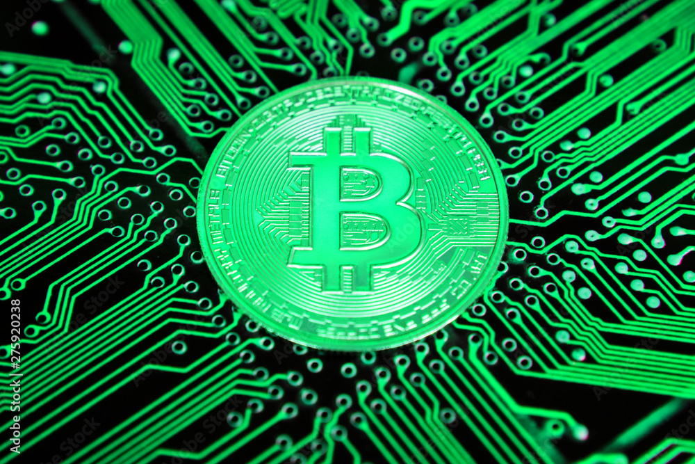 green bitcoin on the circuit board green bitcoin on the circuit board