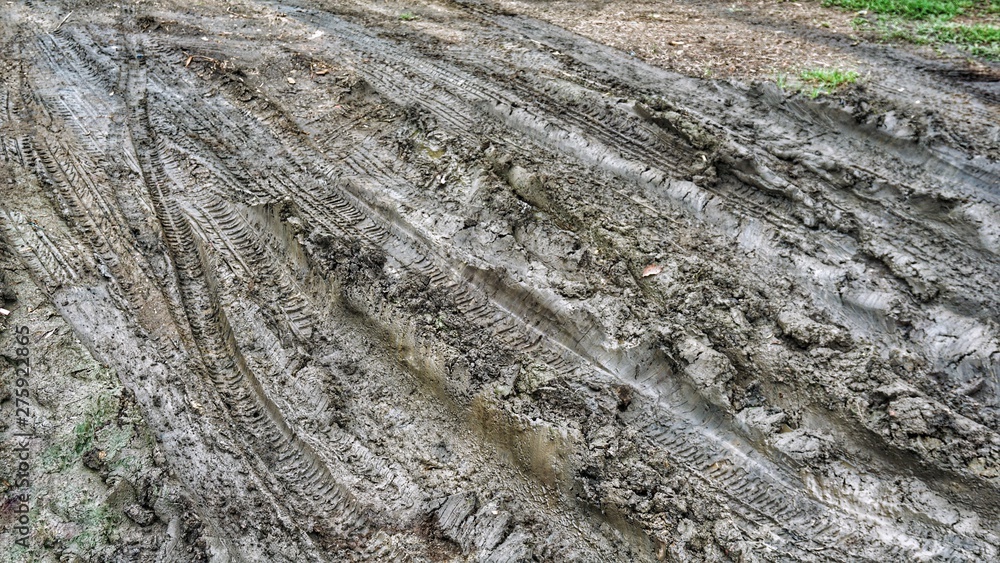 Wheel track on mud, Clay texture background Wheel track on mud, Clay texture background