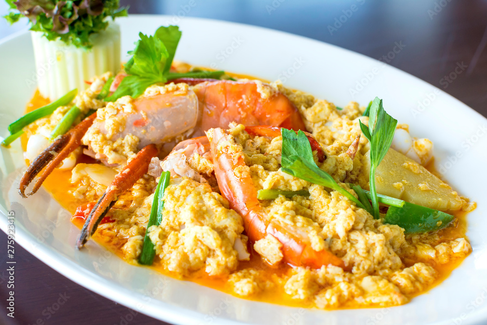 Stir fried shrimp or prawn in curry powder the famous delicious Thai food Stir fried shrimp or prawn in curry powder the famous delicious Thai food