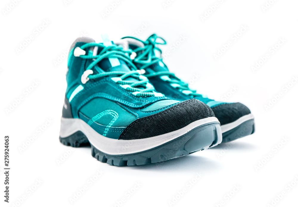 A pair of hiker green mountain sport boots, isolated on white background. A pair of hiker green mountain sport boots, isolated on white background.