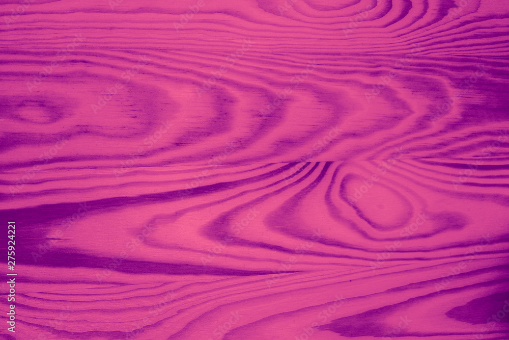 Fototapeta premium Abstract violet wooden desk background. Fancy pink board backdrop.