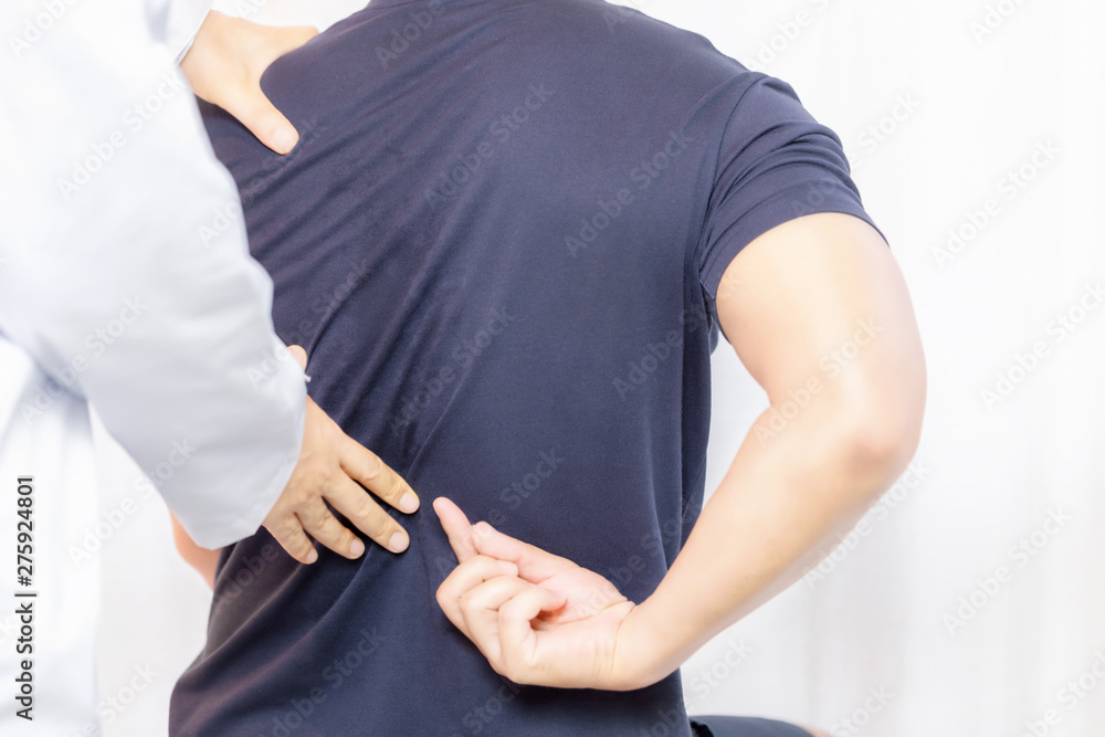 Close up of Physiotherapist working with patient in clinic Close up of Physiotherapist working with patient in clinic