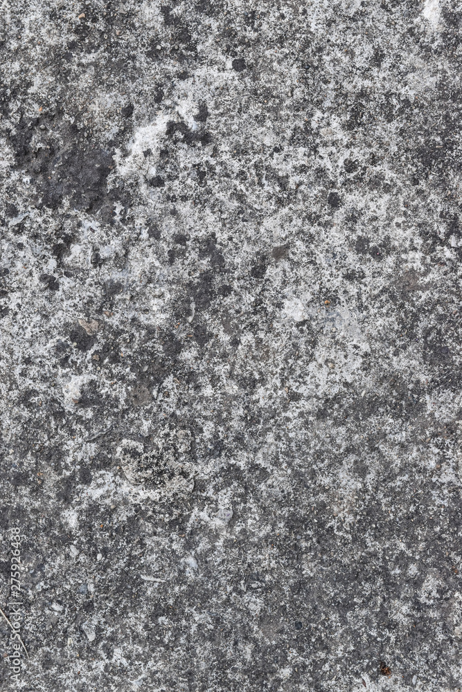 Grunge grey concrete wall with crack and stains in industrial building. Cement texture for design and background.