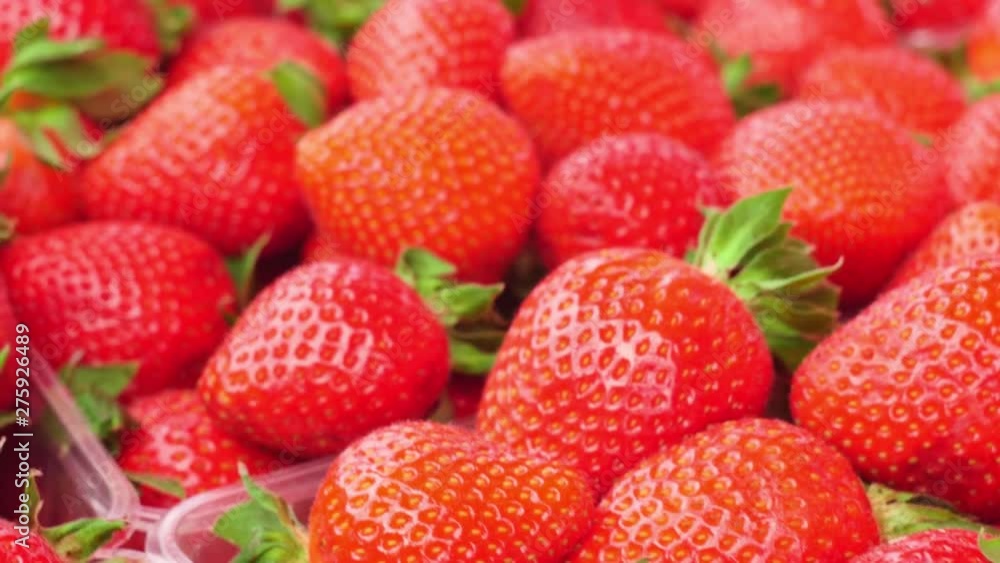 Strawberry background. Red ripe organic strawberries on market counter. Strawberry background. Red ripe organic strawberries on market counter.