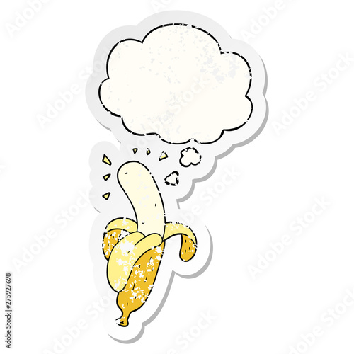 cartoon banana and thought bubble as a distressed worn sticker