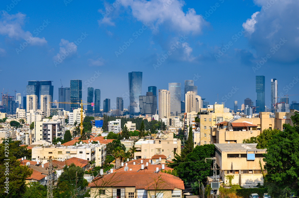 Tel Aviv skyline in early morning.  View to the city from Givataim hills.  Old houses and new modern skyscrapers.