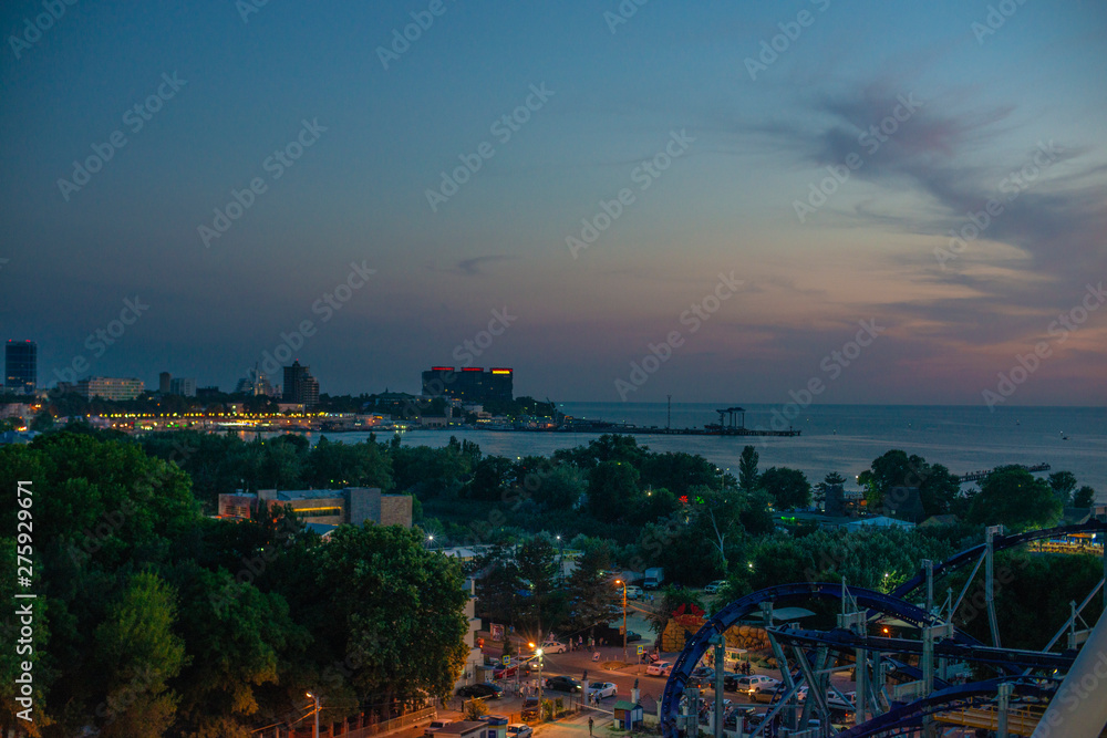 Beautiful view of coastal city Anapa with river flowing into the sea on the sunset.