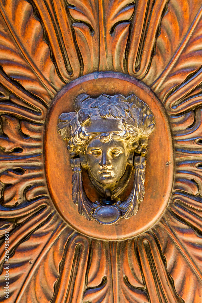 Detail of the vintage door knocker from Montalcino, Italy