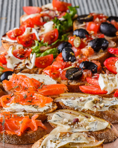 Assorted bruschetta Set of various appetizing snacks sandwiches