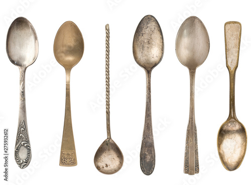 Vintage old tea spoons isolated on white background