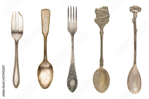 Vintage tea spoons and forks isolated on a white background. Retro silverware