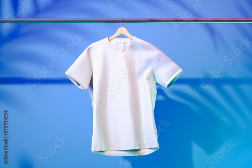 White blank t-shirt on blue background with tropic plants shadows. 3d rendering