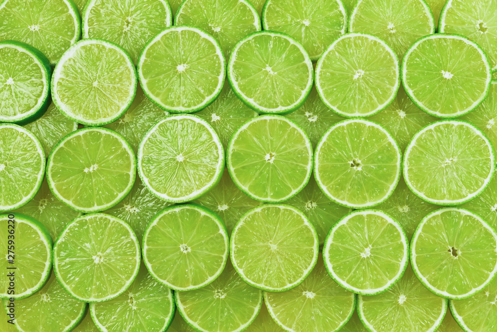 Fresh lime slices as a background. Fresh lime slices as a background.