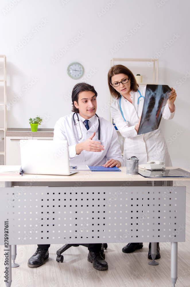 Two doctors working in the clinic Two doctors working in the clinic