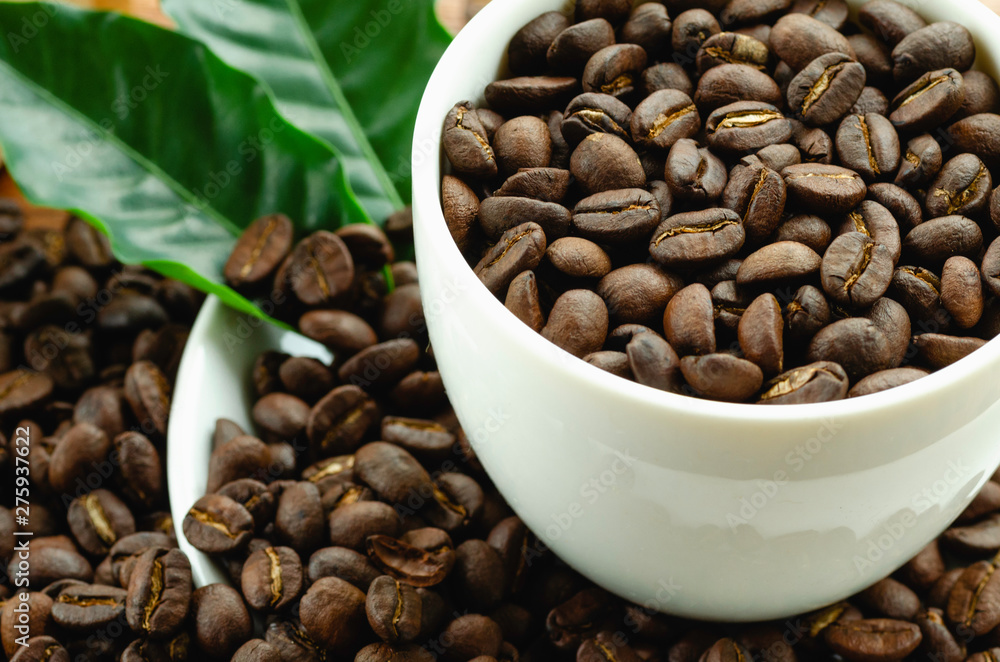 Coffee beans in coffee cup Coffee beans in coffee cup