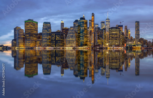 Panorama scene of New york Cityscape with Brooklyn Bridge beside the east river at the twilight time  Reflection concept  USA downtown skyline  Architecture and building with tourist concept