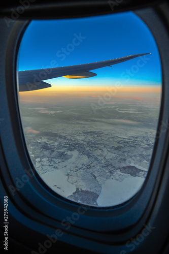 Out side above view from airplane side windows when sunrise  transportation and traveler concept