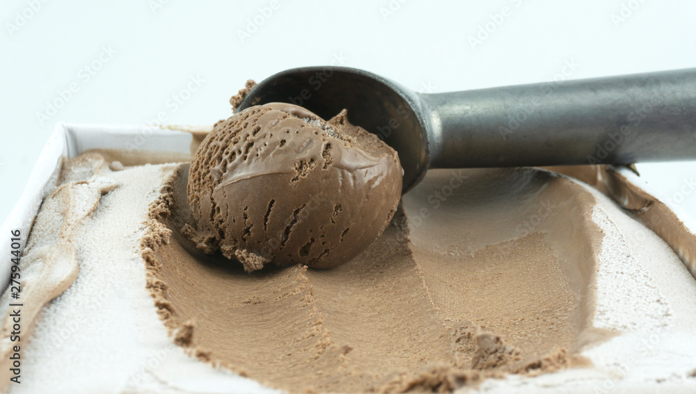 Fototapeta premium Scooping ice cream with a spoon, Closeup Top view, Blank for design.