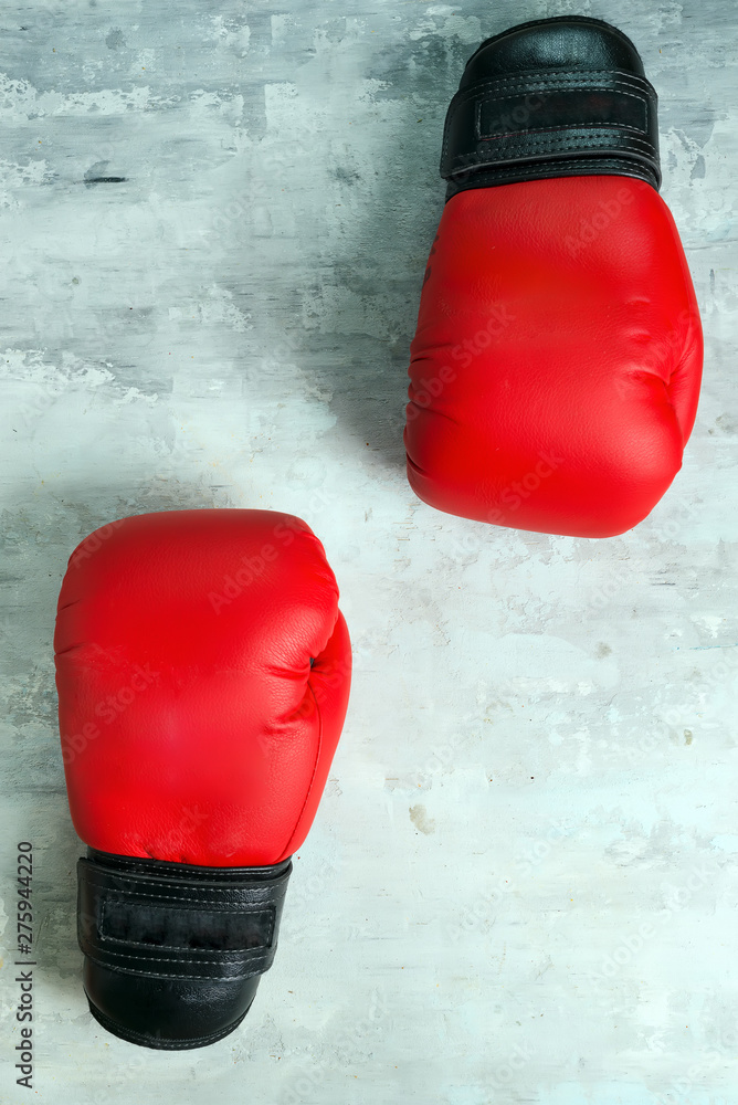 Pair red of boxing gloves on grey background,