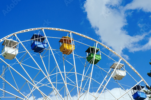 Ferris wheel in the park against the sky
