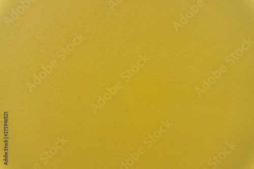 Fresh yellow painted concrete cement texture wall abstract background.