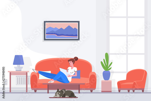 Relaxed female sitting on couch and browsing laptop while spending time at home.