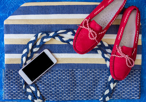 Flat lay of summer accessories, smartphone and camera. Summer outfit concept.