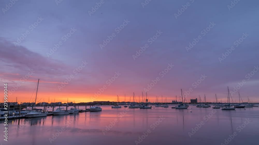 Time Lapse of Colorful Boston Skies at Sunrise With Boats in the Foreground Time Lapse of Colorful Boston Skies at Sunrise With Boats in the Foreground