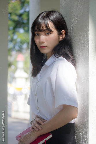 Free Download Portrait of thai adult student university uniform beautiful girl relax and smile - GFXLoad