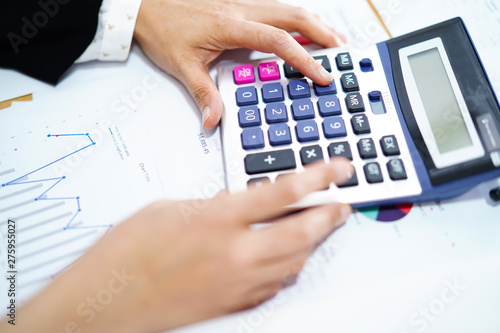 Press calculator on chart and graph paper. Finance development, Banking Account, Statistics, Investment Analytic research data economy, Stock exchange trading, Business company concept.