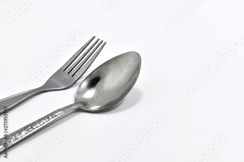 Spoon and fork placed together
