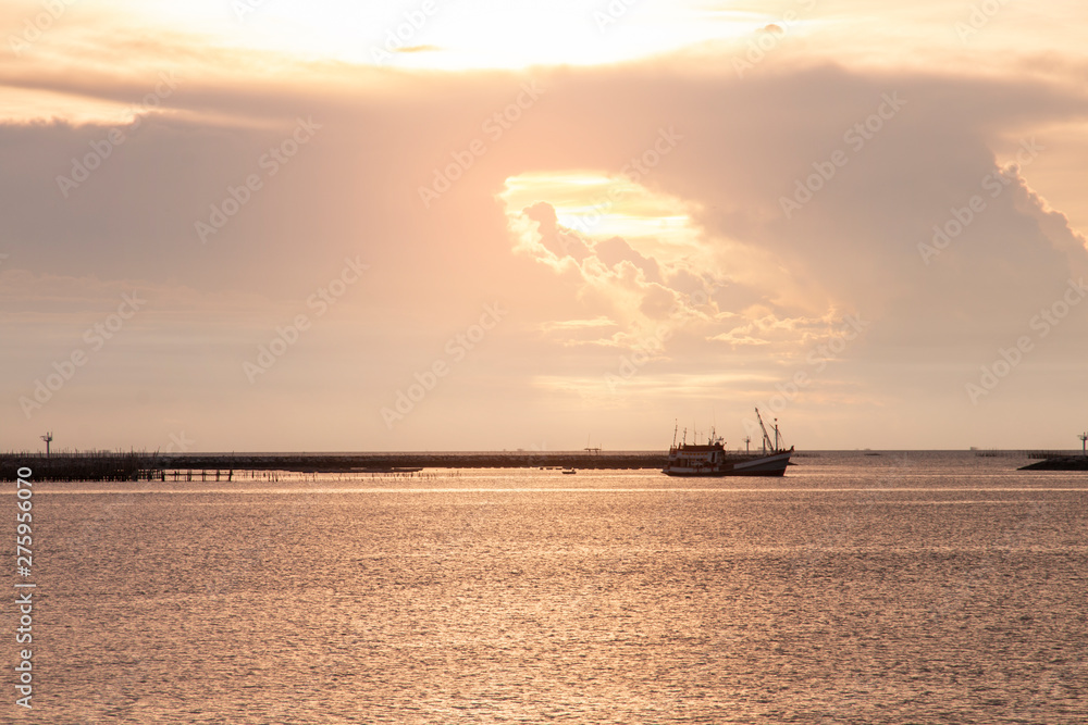 fishing boat in the sea at evening time. fishing boat in the sea at evening time.