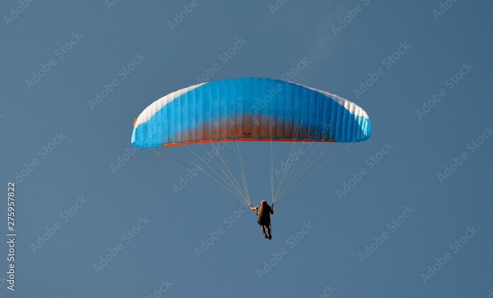 paraglider flight through the blue sky paraglider flight through the blue sky