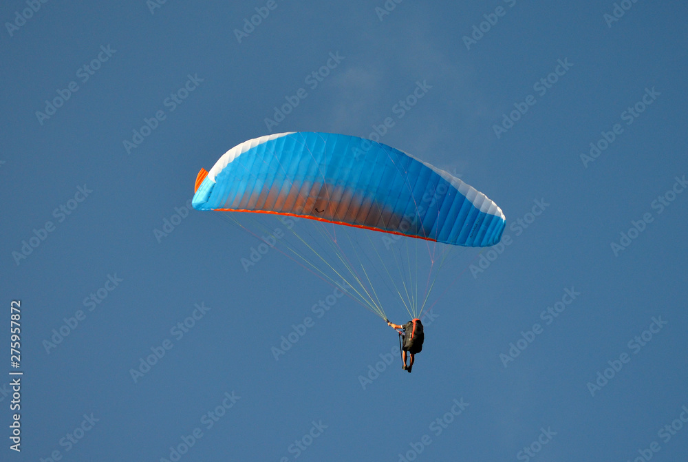 paraglider flight through the blue sky paraglider flight through the blue sky