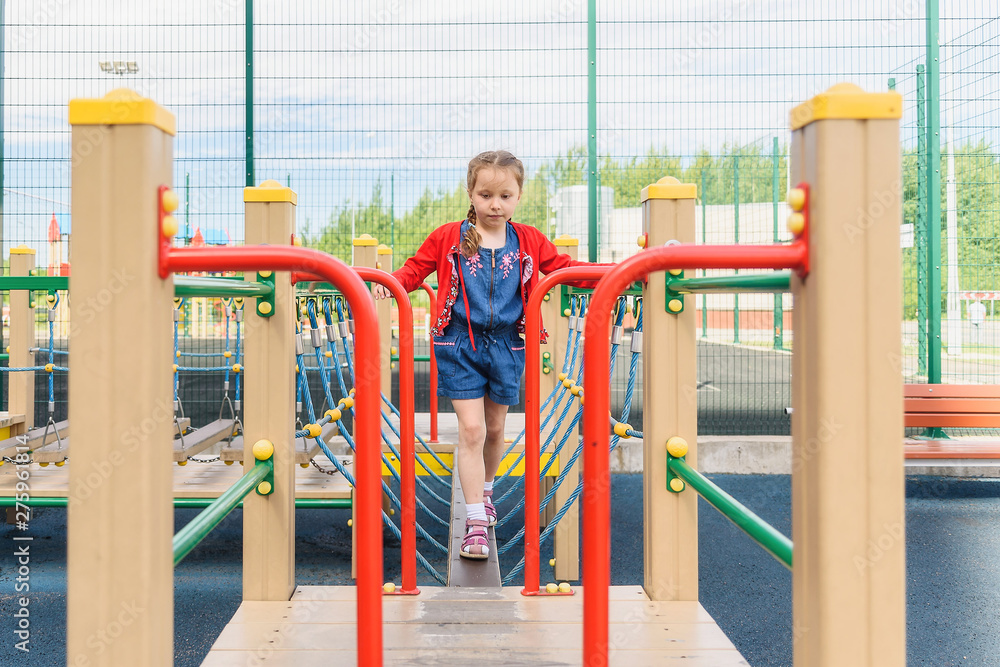 Fototapeta premium Active little girl on playground