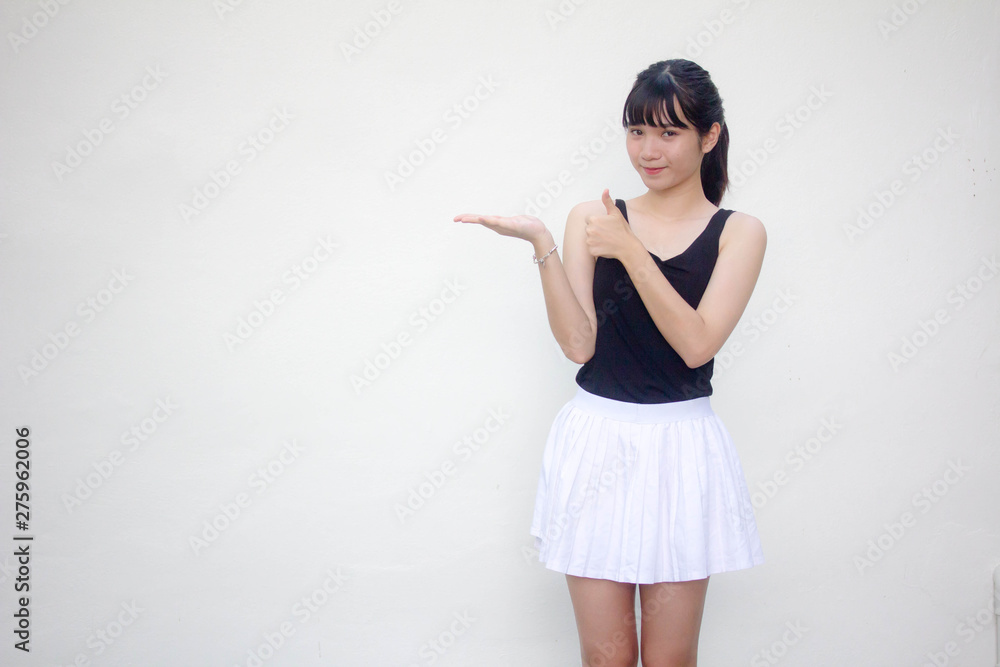 Portrait of thai adult beautiful girl black shirt white skirt show hand
