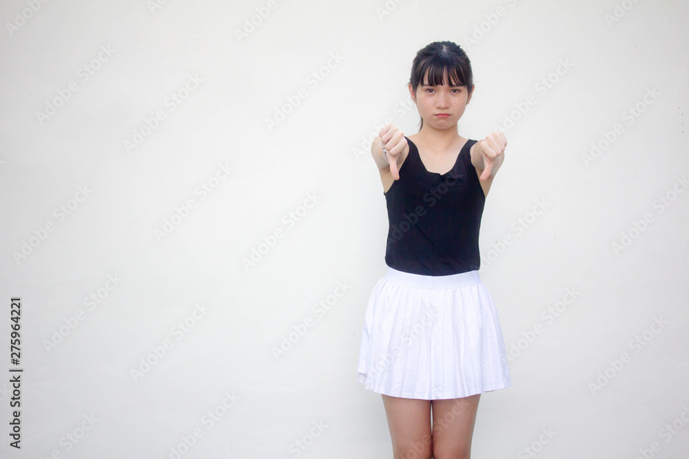Portrait of thai adult beautiful girl black shirt white skirt do not like Portrait of thai adult beautiful girl black shirt white skirt do not like