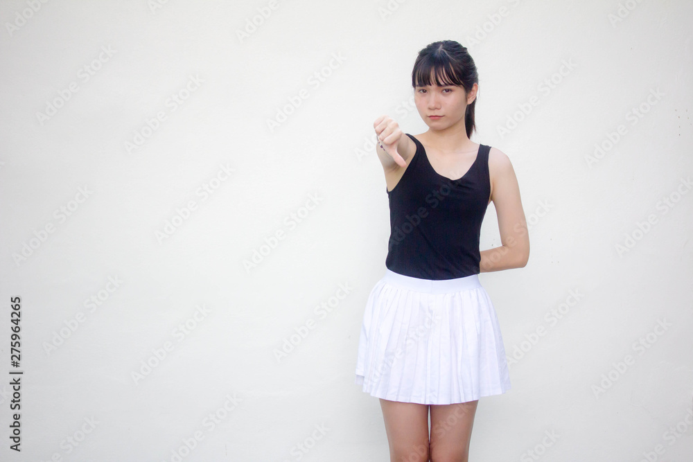 Portrait of thai adult beautiful girl black shirt white skirt do not like Portrait of thai adult beautiful girl black shirt white skirt do not like