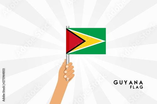 Vector cartoon illustration of human hands hold Guyana flag. Isolated object on white background.
