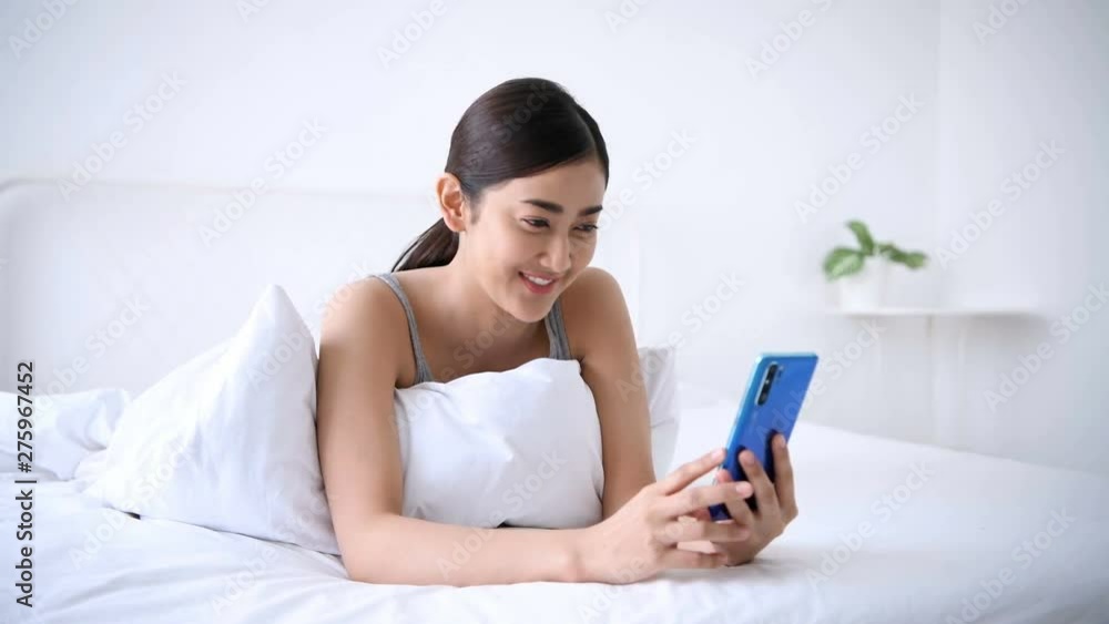 Holiday concept. Asian women are contacting her friends with a mobile phone. Holiday concept. Asian women are contacting her friends with a mobile phone.